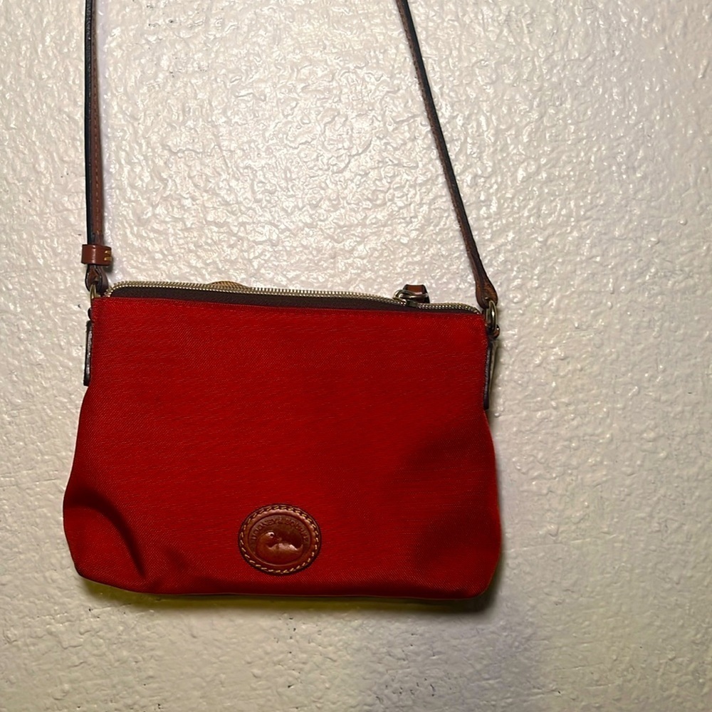 Dooney and Bourke orange small Crossbody bag made of canvas